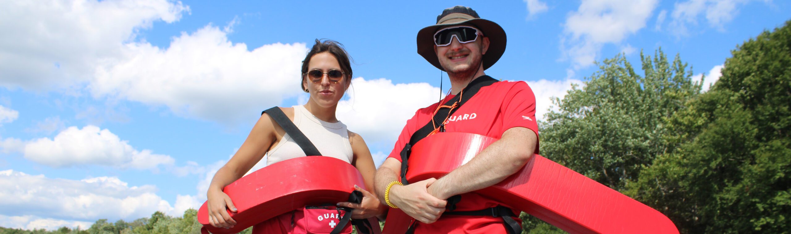 Group of diverse young people smiling at a community event