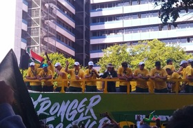 Group of people celebrating on stage