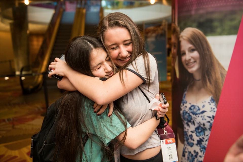 Group of people celebrating on stage