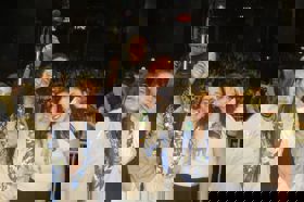 Group of people celebrating on stage