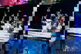 Group of people celebrating on stage