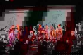 Group of people celebrating on stage