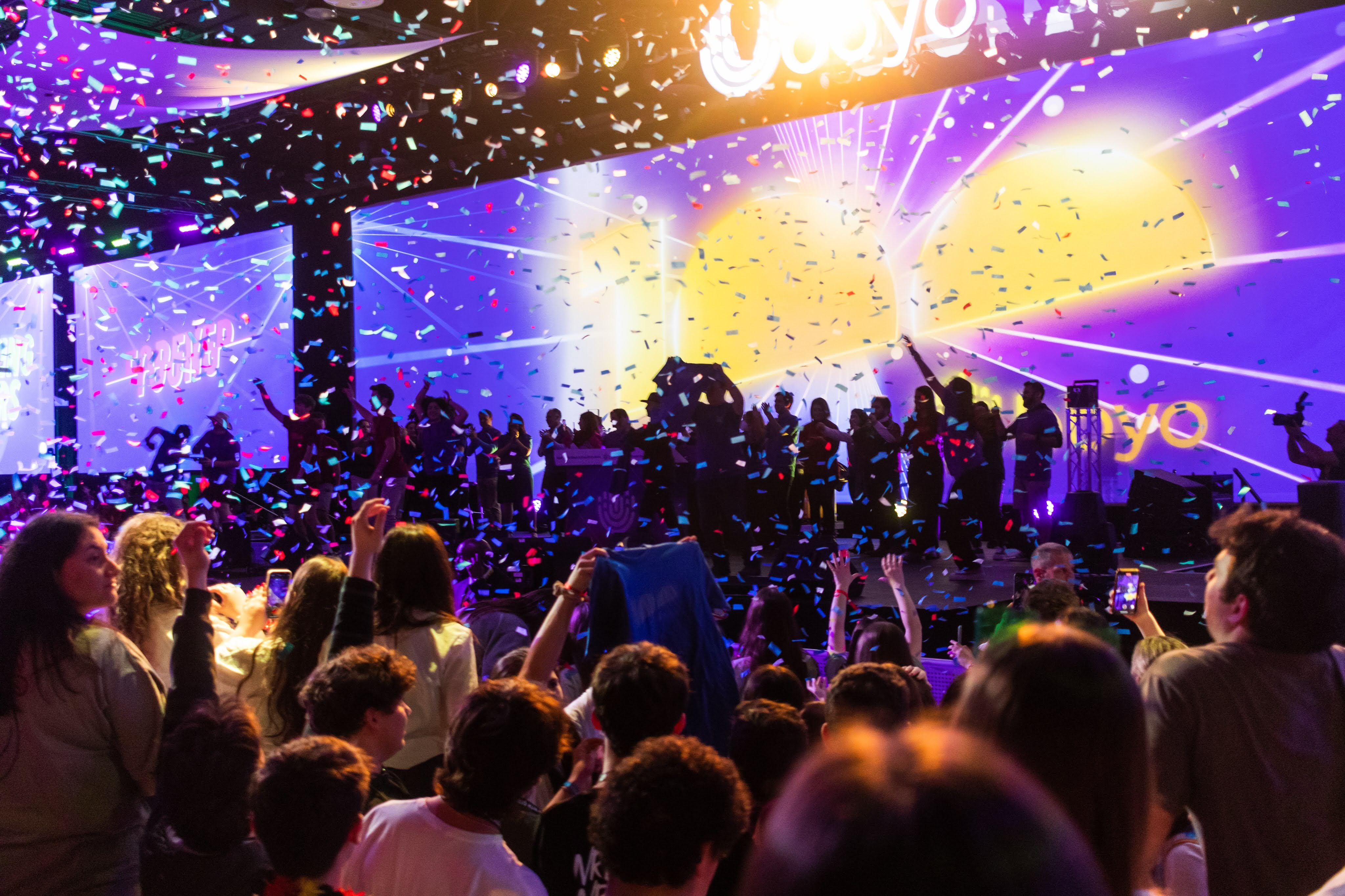 Group of people celebrating on stage