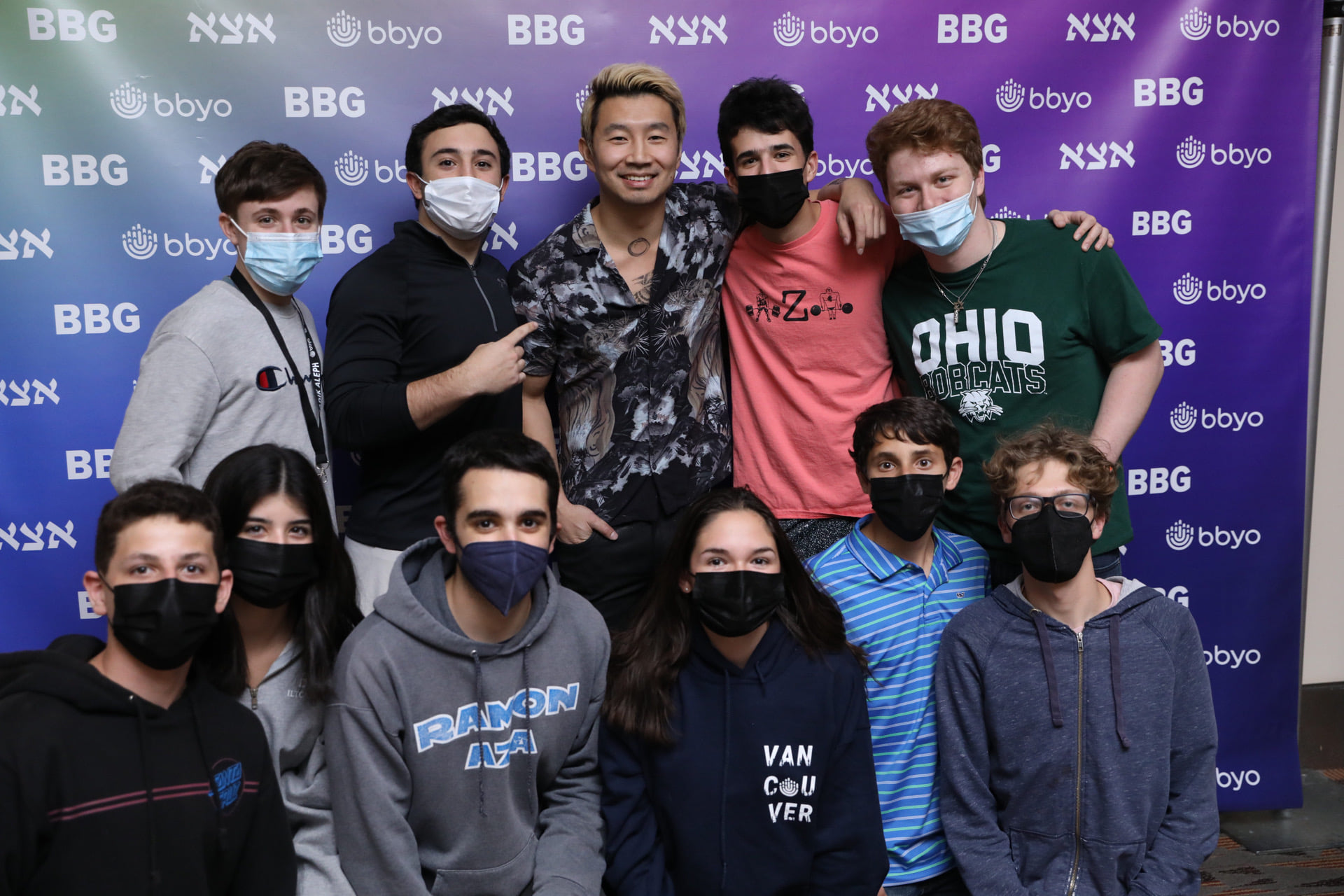 Group of people celebrating on stage