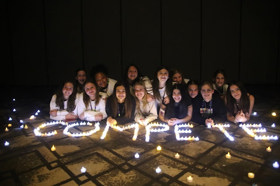 Group of people celebrating on stage