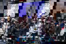 Group of people celebrating on stage