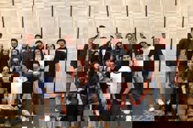 Group of people celebrating on stage