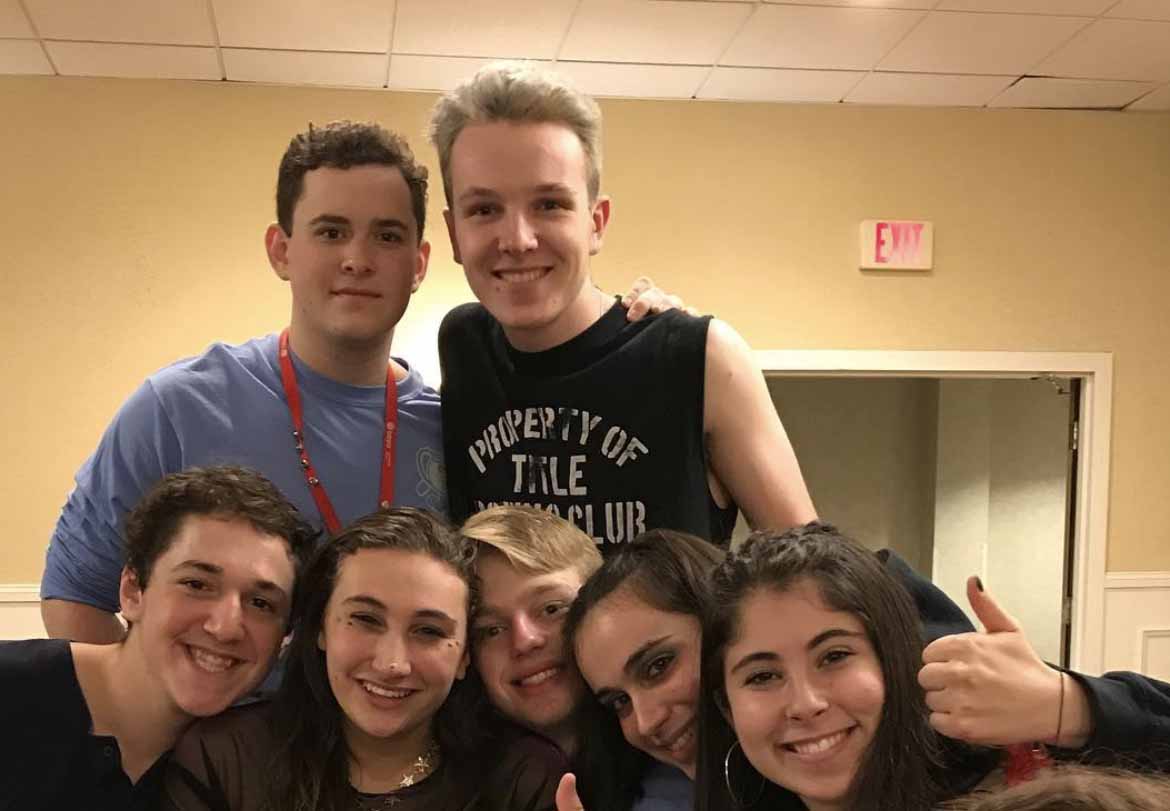 Group of people celebrating on stage