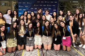 Group of people celebrating on stage