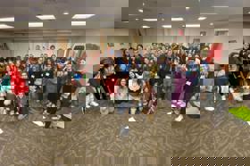 Group of people celebrating on stage