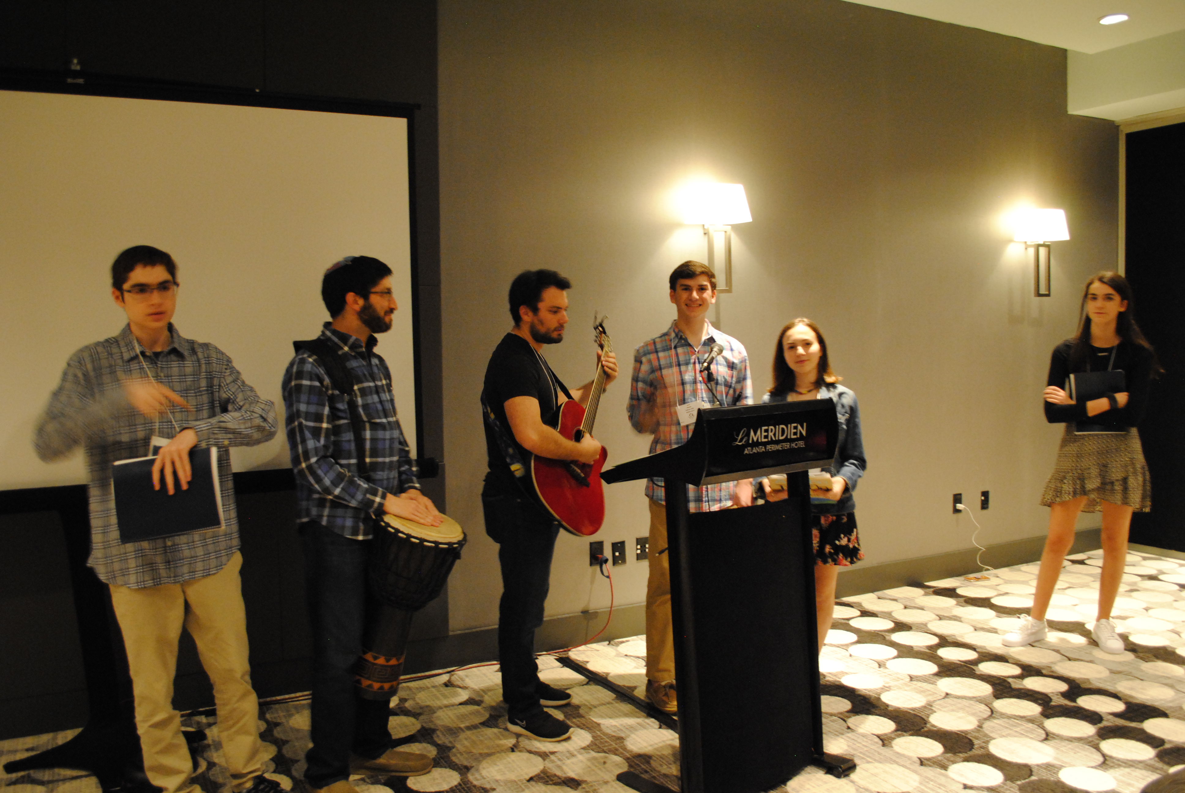 Group of people celebrating on stage
