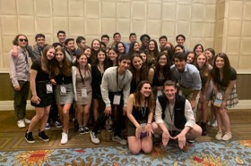 Group of people celebrating on stage