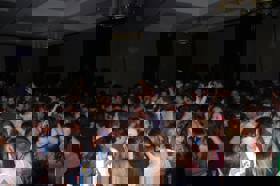 Group of people celebrating on stage