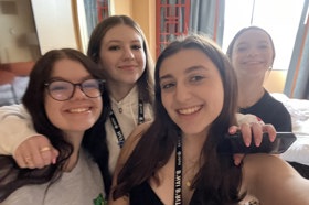 Group of people celebrating on stage