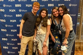 Group of people celebrating on stage