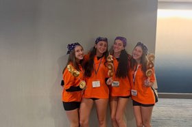 Group of people celebrating on stage