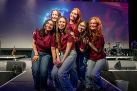 Group of people celebrating on stage