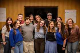 Group of people celebrating on stage