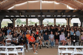 Group of people celebrating on stage