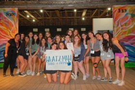 Group of people celebrating on stage