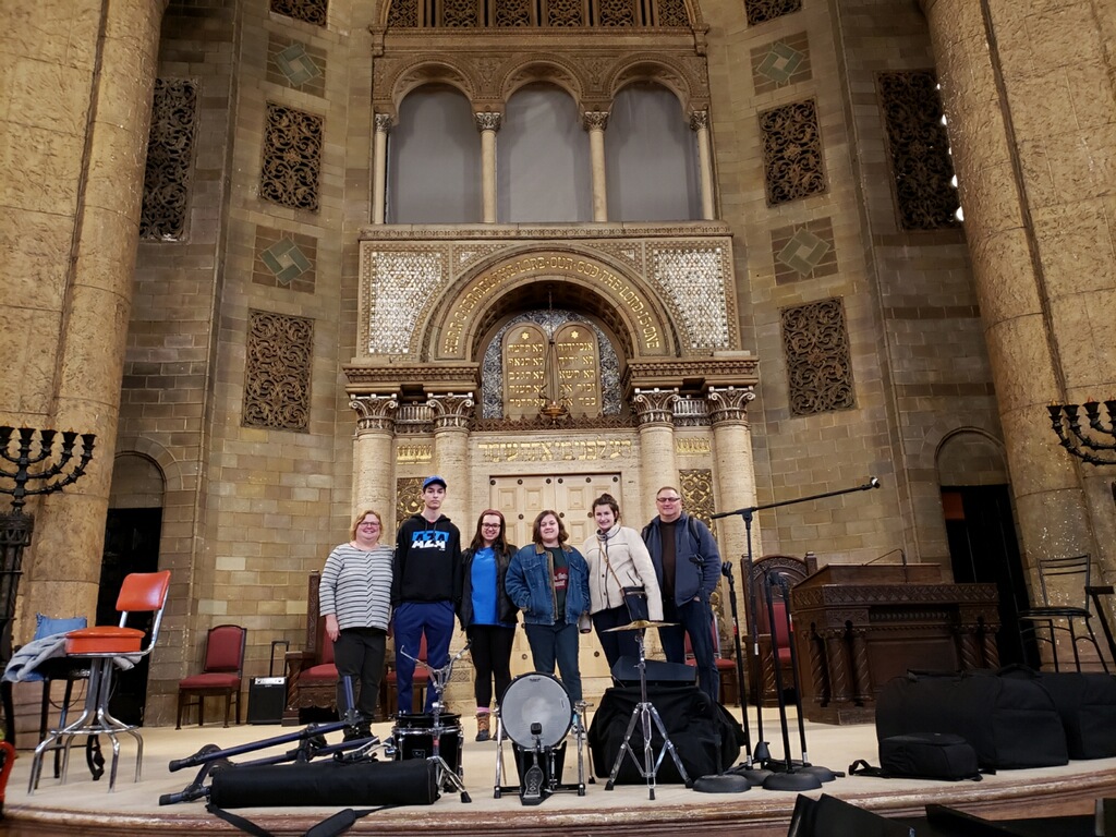 Group of people celebrating on stage