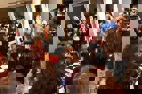 Group of people celebrating on stage