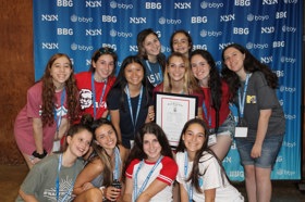 Group of people celebrating on stage