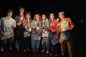 Group of people celebrating on stage