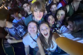 Group of people celebrating on stage