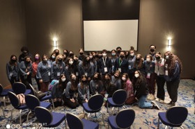 Group of people celebrating on stage