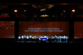 Group of people celebrating on stage