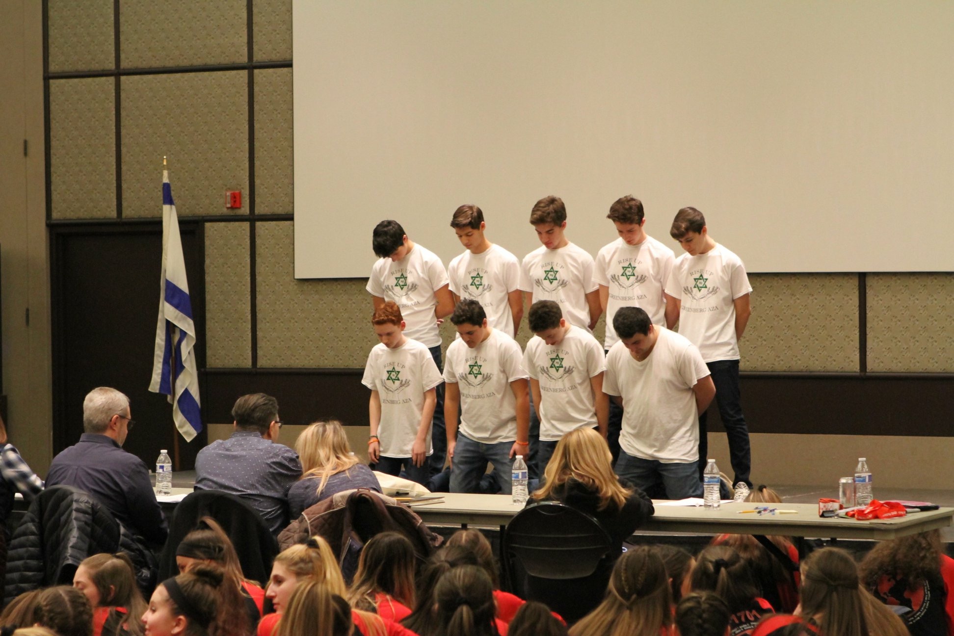 Group of people celebrating on stage