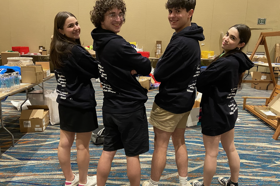 Group of people celebrating on stage