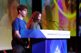 Group of people celebrating on stage