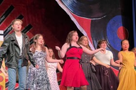 Group of people celebrating on stage